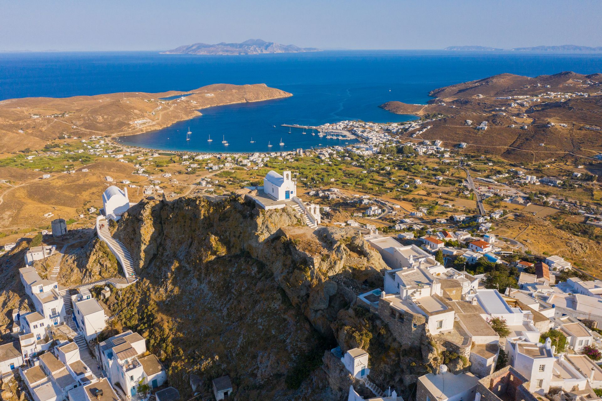 From the beautiful chapel of Agios Konstantinos nearby, you can look out beyond Livadi onto Cycladic islands… Sifnos, Milos and (on clear days) Tinos and Mykonos