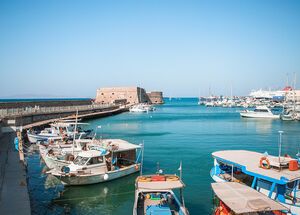 Fishing boats by Koules Fortress in the harbour of Heraklion old town